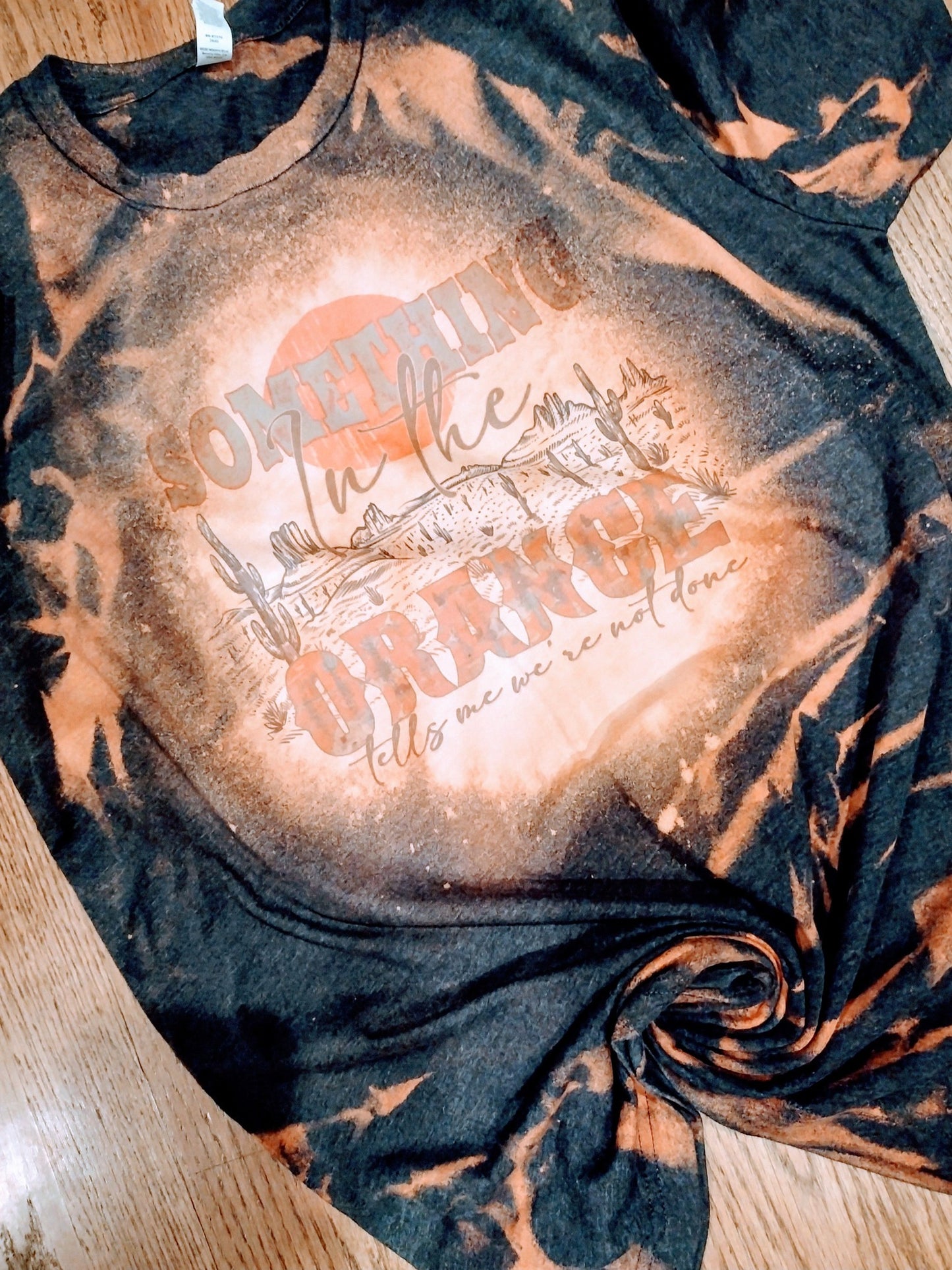 Something in the orange bleach tee