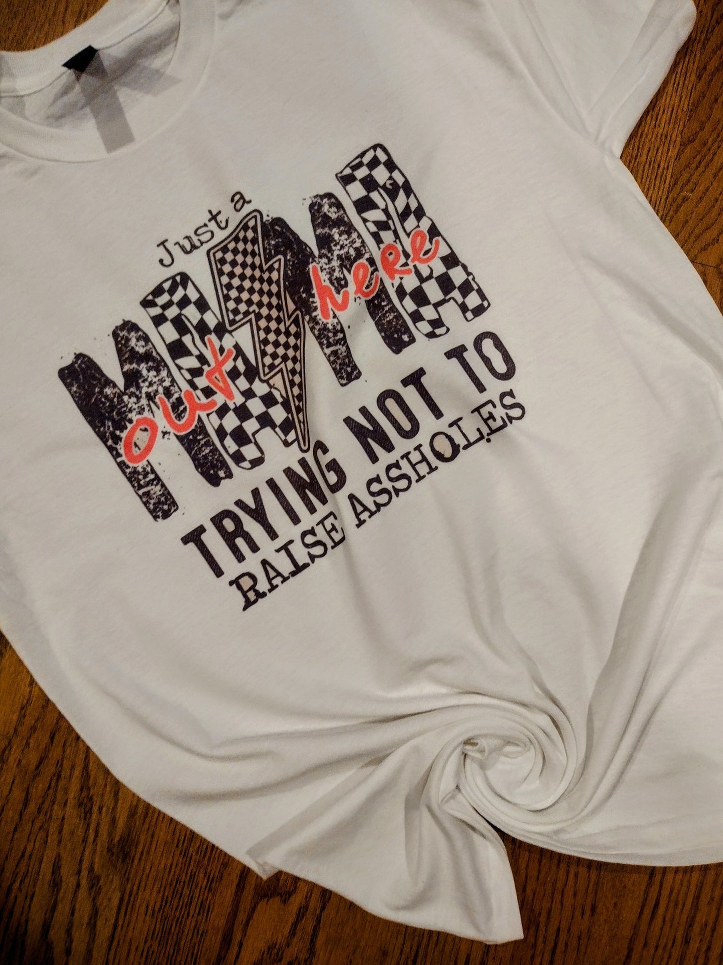 Just a mom trying not to raise assholes shirt